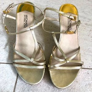Michael Kors gold strappy wedges.